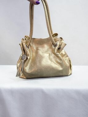 Furla Carmen Metallic Gold Leather Tassel Bag